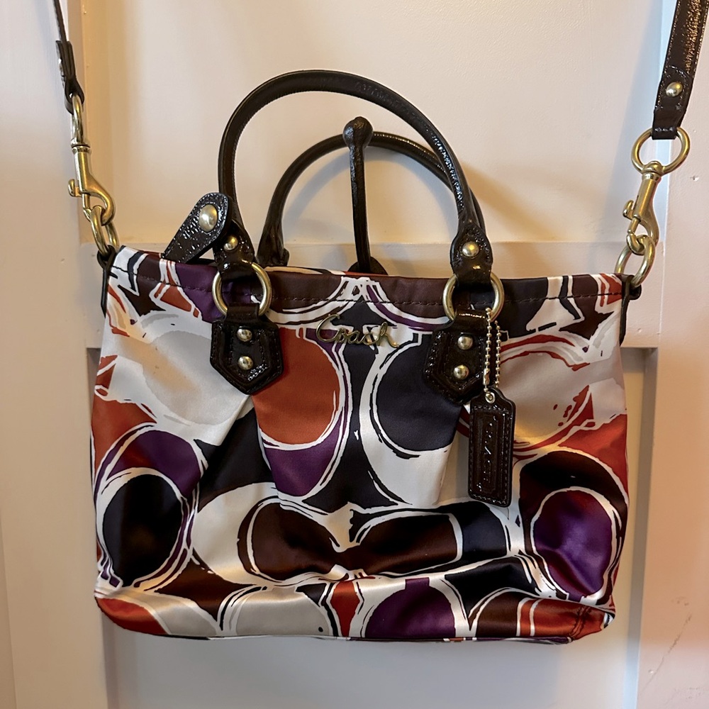 Lightly used Coach bag. Gorgeous colors! Great condition. Detachable strap